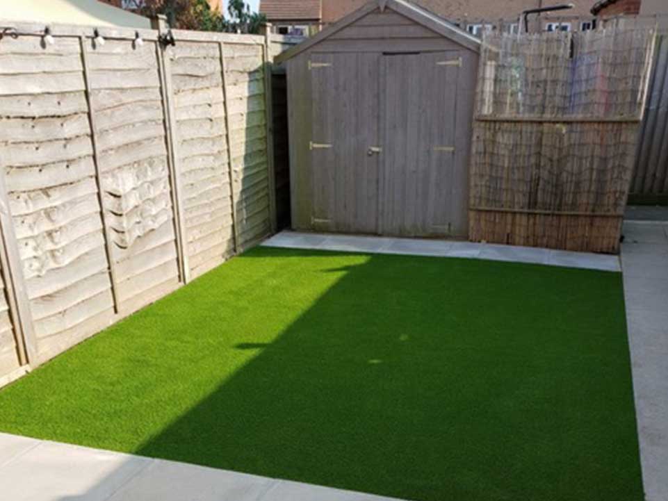Artificial grass, paving slabs, and garden shed