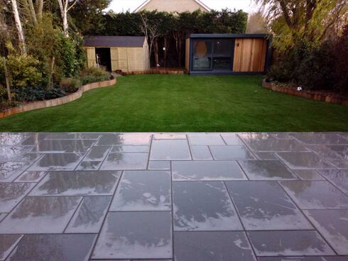 Artificial grass and paving slabs