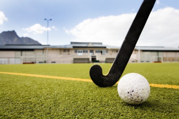hockey pitch grass, stick and ball