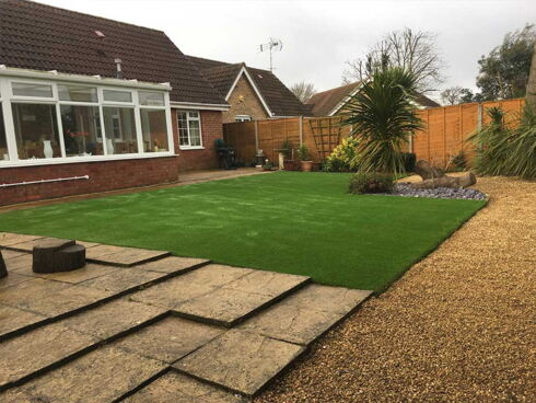 Artificial grass, paving slabs and gravel